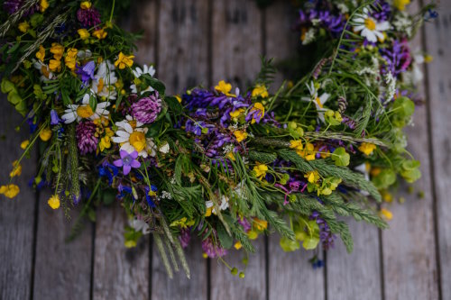 Beautiful floral wreath from meadow flowers. A colorful variety of summer wildflowers. Beautiful floral wreath made from meadow flowers.A colorful variety of summer wildflowers.